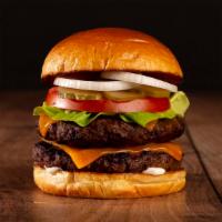 The Double Cheeseburger · Two beef patties, lettuce, tomato, onion, pickles, mayo, and melted cheddar cheese on a brio...