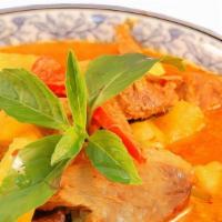 Pineapple Curry · Light coconut red curry with pineapple chunks, peppers, tomatoes, and basil leaves.
medium s...