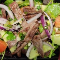 Yum Nua · Grilled steak with spicy vinaigrette, red onions, scallion, cilantro, cucumber & tomatoes.
*...