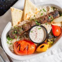 Turkish Lamb Kabob · one ground lamb skewer with grilled vegetables served on top of basmati rice