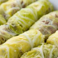 Cabbage Rolls · stuffed cabbage with rice and ground beef, cooked in tomato lemon sauce. served with babagan...