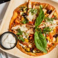 Chicken Shawerma Pizza · pesto sauce , tomatoes , olives , banana peppers , feta cheese and mozzarella cheese