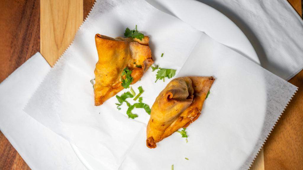 Vegetable Samosa (2 Pieces) · Turned over, stuffed with spicy potatoes and peas
