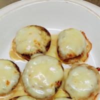 Stuffed Mushrooms · Mushrooms stuffed with crab meat stuffing & topped with mozzarella cheese.