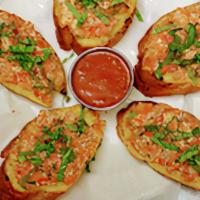 Bruschetta · Chopped fresh tomatoes with garlic, basil, olive oil and vinegar. Served on slice bread.