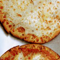 White Pizza · Roasted garlic, olive oil, and oregano over mozzarella cheese. No tomato sauce.