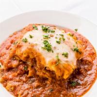 Baked Lasagna · Lasagna baked in meat sauce. Served with garlic bread.