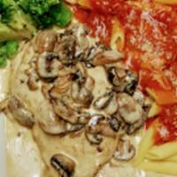 Veal Angelica · Veal scaloppini with mushrooms in white wine and cream sauce. Served with garlic bread.