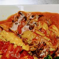 Chicken Alla Nonna · Chicken breast with artichokes, mushrooms, capers, white wine, and a touch of tomato sauce. ...