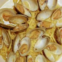 Fresh Clams Over Linguini · Fresh clams cooked in white wine lemon butter sauce and clam juice. Served over linguine wit...