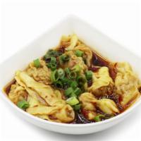 Spicy Tangy Wonton · Steamed pork wontons. Served W. spicy tangy chili sauce, topped W. scallions