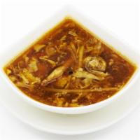 Hot Sour Soup · Spicy Minced chicken, tofu, eggs, and bamboo shoots.  served with crispy noodles on the side.