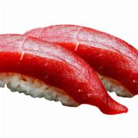 Tuna · Choice of: Sashimi (3 pc.) or Nigiri (2 pc.)
served w. ginger & wasabi.