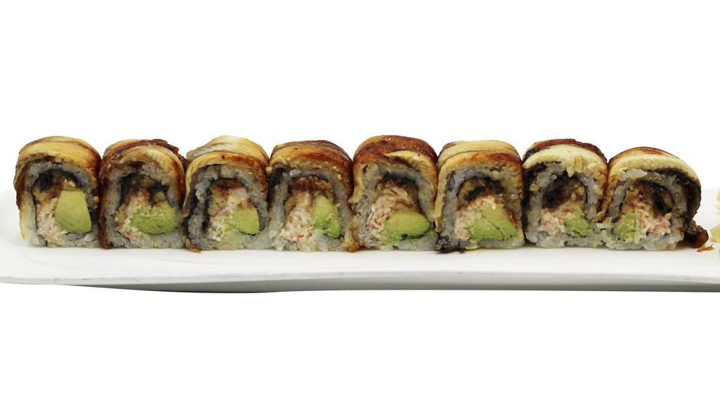 Dragon Roll (8Pc.) · Cut in 8 pc. Inside: Eel, crab mix, avocado. Topped: W. eel. Served w. eel sauce