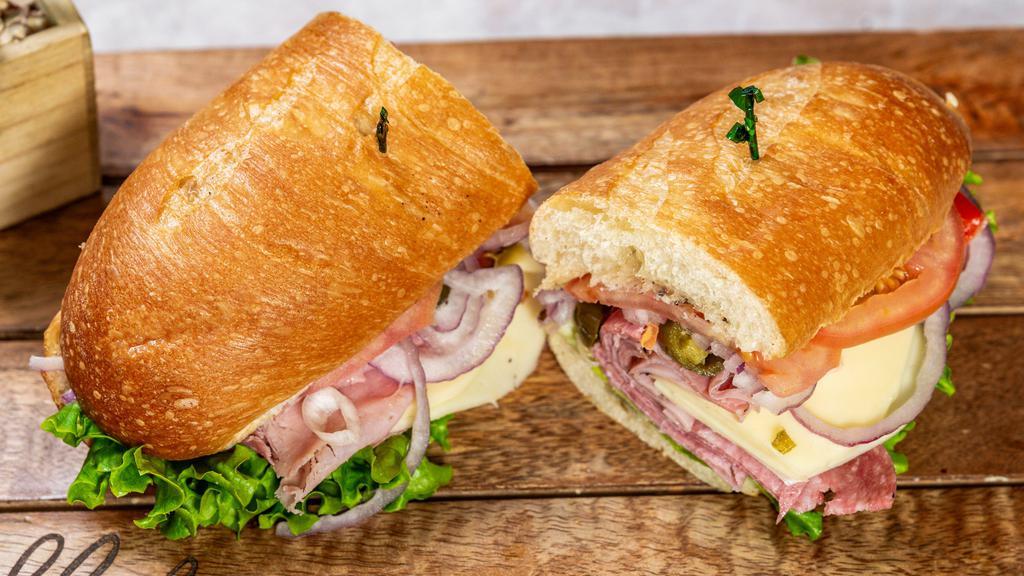 Bean Bag Sub · Ham, salami, and provolone cheese on a sub roll with Italian dressing, lettuce, and tomato. Onions and hot peppers upon request. Choose your size: big bean (1/2 lb or more of meats and toppings) or beanie (1/4 lb or more of the same).
