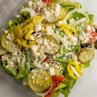 Greek Salad · Served with lettuce, tomatoes, onions, green peppers, pickles, cucumbers, olives and feta ch...