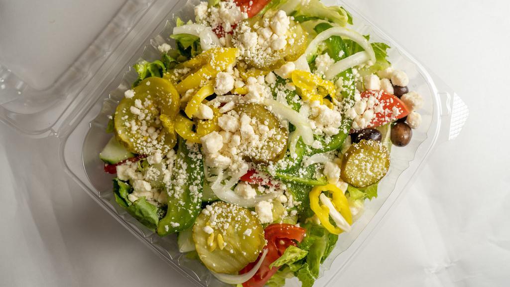 Greek Salad · Served with lettuce, tomatoes, onions, green peppers, pickles, cucumbers, olives and feta cheese.