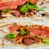 Blt Wrap · Bacon, lettuce and tomato wrapped in a flour tortilla.