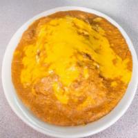Burritos · Filled with picadillo, rice, beans and topped with gravy and cheese. Add asada or beef fajit...