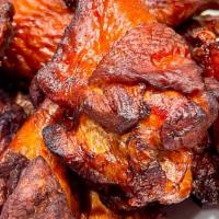 Naked Wings · One dozen brined and fried chicken wings (not breaded) tossed in choice of Smokeheads Buffal...