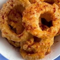 Pub Onion Rings · A large portion of beer battered onion rings, served with a side of Smokeheads Texas Mop BBQ...