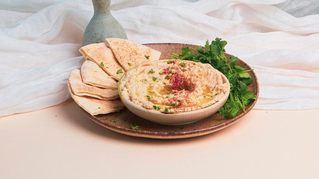 Baba Ghanoush · Fire roasted eggplant mixed with garlic, tahini, and lemon juice. Served with pita.