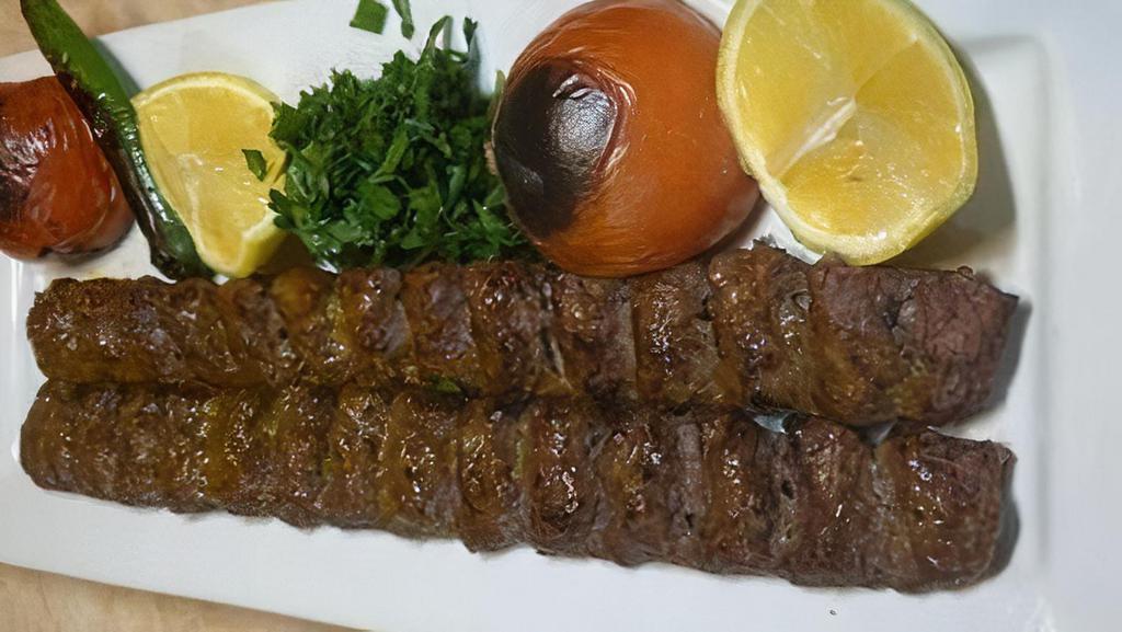 Beef Kebab Plate · Skewer of grilled beef. Basmati rice topped with saffron. Sided with grilled tomatoes and vegetables.