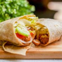 Chicken Shawarma Wrap · With lettuce, tomato, onions and white sauce.