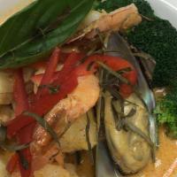 Panang Curry · Spicy. Cooked with coconut peanut curry sauce with basil.