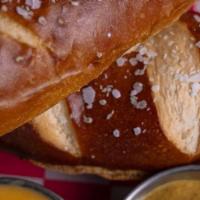 Soft Baked Pretzel · Served with queso and whole grain mustard.