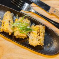 Grilled Corn · Three pieces of our version robata style street corn.