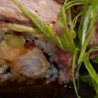 Surf & Turf Roll · Panko shrimp, bacon, scallop delight, avocado, asparagus, and seared ribeye.
