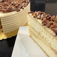 Bourbon Caramel Crunch Cake Slice · Vanilla cake soaked with bourbon syrup and layered with vanilla bean cream cheese frosting, ...