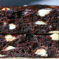 Triple Chocolate Brownie Slice · A chocolate brownie made a combination of Milk Chocolate Chips, Dark Chocolate Chips and Whi...