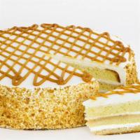 Tres Leche Cake Slice · Where pudding and cake cross paths, tres leches cake is basking in a golden glow. Layers of ...