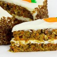 Carrot Cake Slice · This classic, mosit cake with cream cheese icing is complete with a little carrot icing deco...