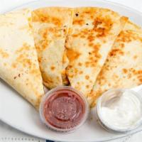 Chicken Quesadilla · Grilled flour tortilla stuffed with chicken, onions, green peppers, and a Mexican blend chee...