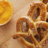 Pretzel & Cheese · Soft pretzel baked and salted served with a melted cheese sauce.