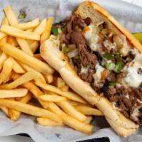 Philly Cheese Steak · Tender ribeye grilled with sautéed onion, green pepper topped with mozzarella cheese on a to...