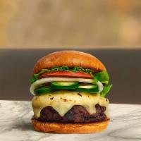 Hola Jalapeno Burger · American beef patty topped with melted pepper jack cheese, jalapenos, buttered lettuce, toma...