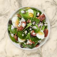 Spinach Salad · Bed of baby spinach with selected toppings.