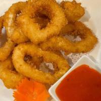 Fried Calamari · Deep-fried battered calamari rings served with sweet chili sauce.