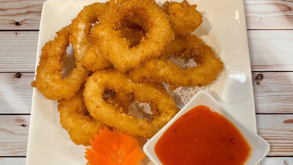 Fried Calamari · Deep-fried battered calamari rings served with sweet chili sauce.
