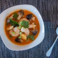 Tom Yum Ⓖ · Thai style hot and sour soup with lemongrass, chili paste, lime leaves, onions, mushrooms, t...