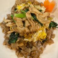 Pad See Ew · Flat rice noodles, Chinese broccoli, and eggs, stir-fried in sweet soy sauce.