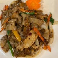 Drunken Noodles · Flat rice noodles, onions, bell peppers, carrots, and Thai basil, stir-fried in spicy chili ...
