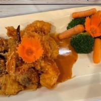 Duck & Shrimp Tamarind · Crispy roasted duck and shrimp, topped with Thai special tamarind sauce, served with steamed...