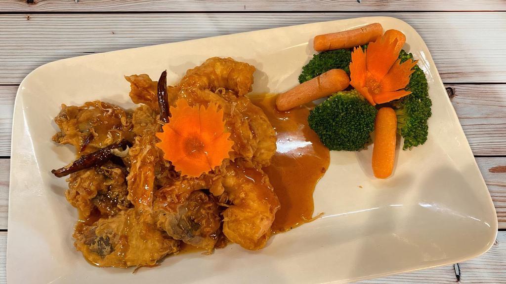 Duck & Shrimp Tamarind · Crispy roasted duck and shrimp, topped with Thai special tamarind sauce, served with steamed mixed vegetables and jasmine rice.