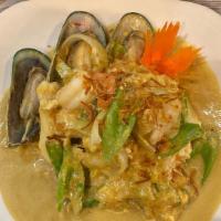 Seafood Curry · Shrimp, squid, scallops, and mussels stir-fried with onions, scallions, celery, and eggs in ...