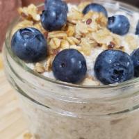 Blueberry Crisp Overnight Oats · Rolled oats soaked in almond milk & mixed with maple syrup, vanilla, blueberries, & almonds.